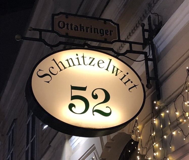 A picture of the sign of the restaurant Schnitzelwirt in Vienna Austria