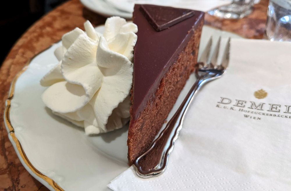 A picture of chocolate cake and cream at Demel Resaurant in Vienna Austria