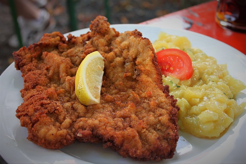 photo of a plate of schnitzel with lemon