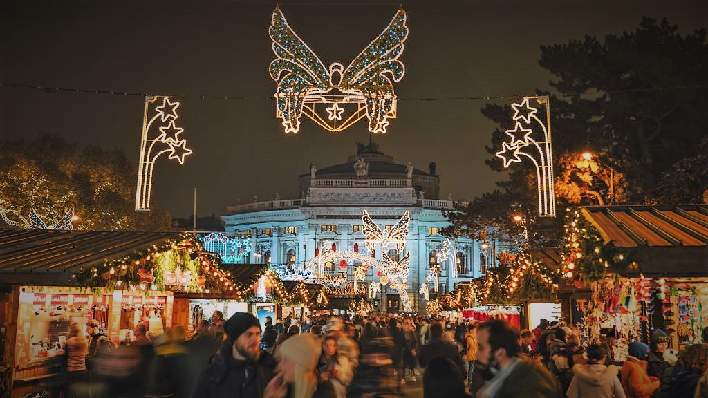 photo of a christmas market in vienna austria at night
