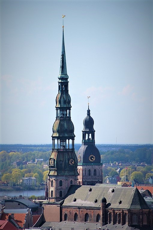 photo of a tall spire on top of a church in Riga Latvia