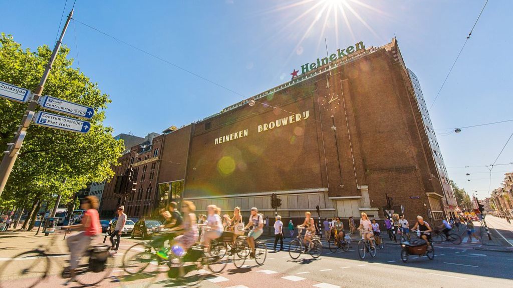 photo of the heineken brewery in amsterdam netherlands with people