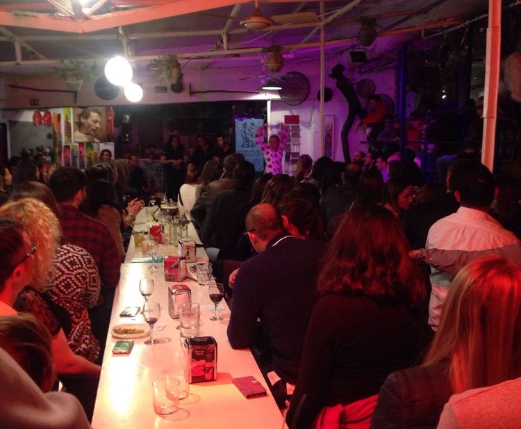 photo of a crowded bar watching flamenco dancing