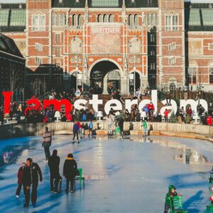 photo of ice rink in amsterdam netherlands with crowds of people