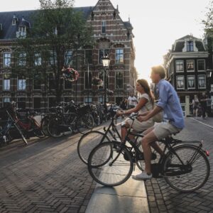 photo of a couple on bikes in amesterdam netherlands