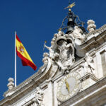 The Spanish Flag Flying Over The Royal Palace In Madrid