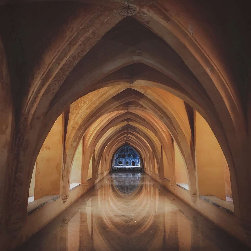 photo of a long hallway in the royal alcazar seville spain