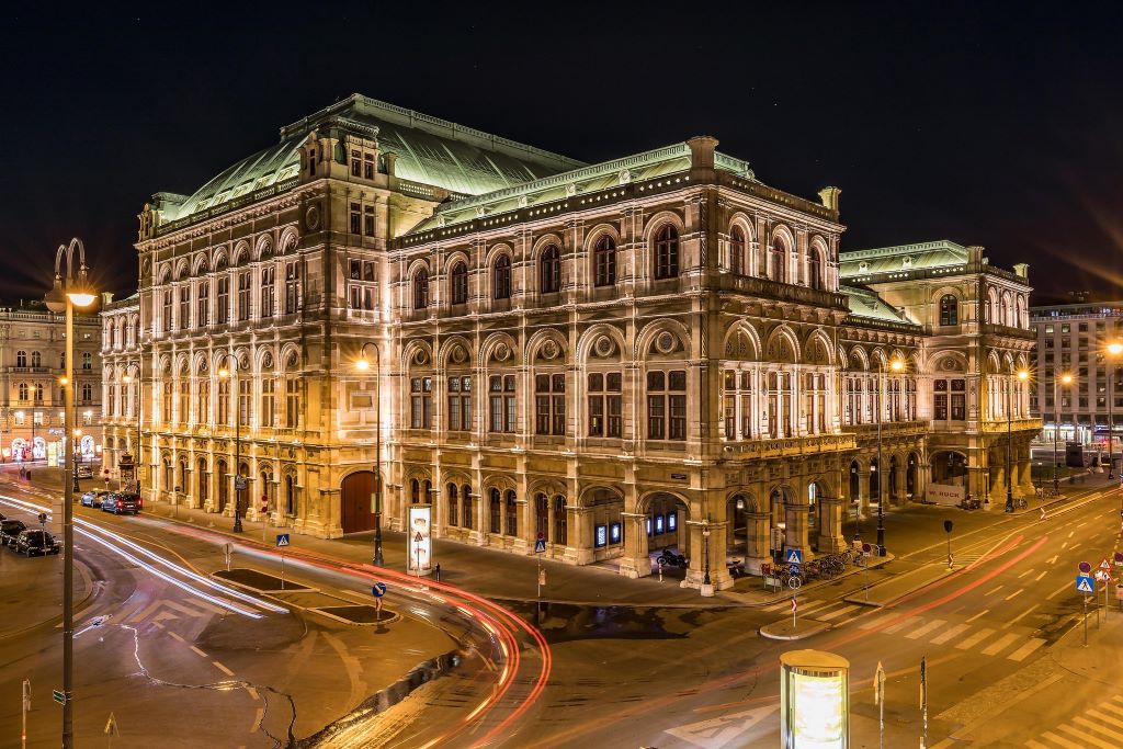 photo of the vienna state opera building at night in vienna austria