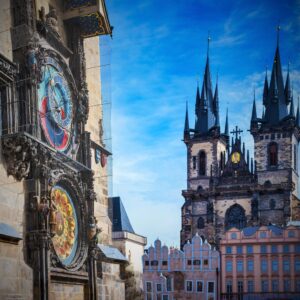 photo of a colorful clock and cathedral in prague czech republic