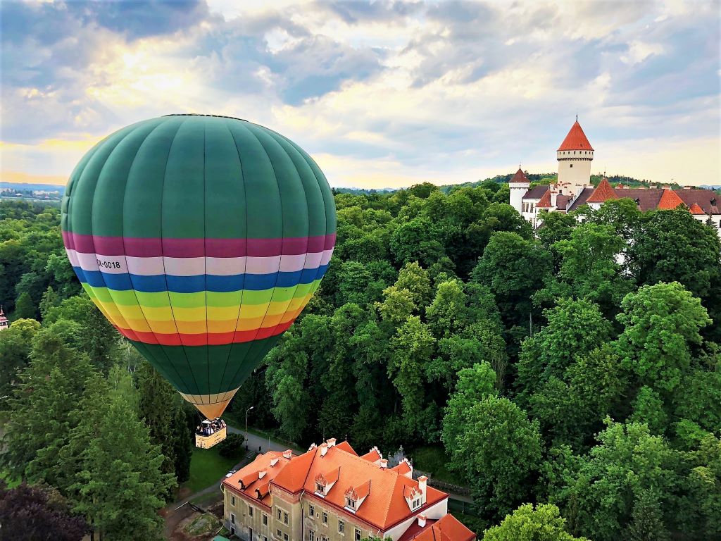 phot of hot air balloon in flight over prague czech republic