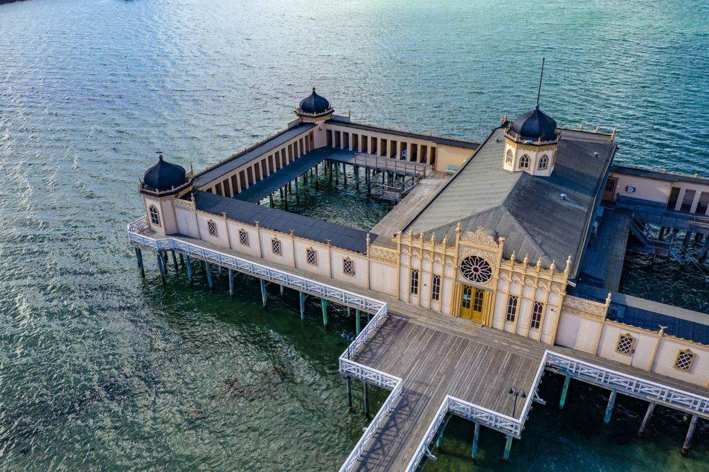photo of a building floating on the ocean in malmo sweden