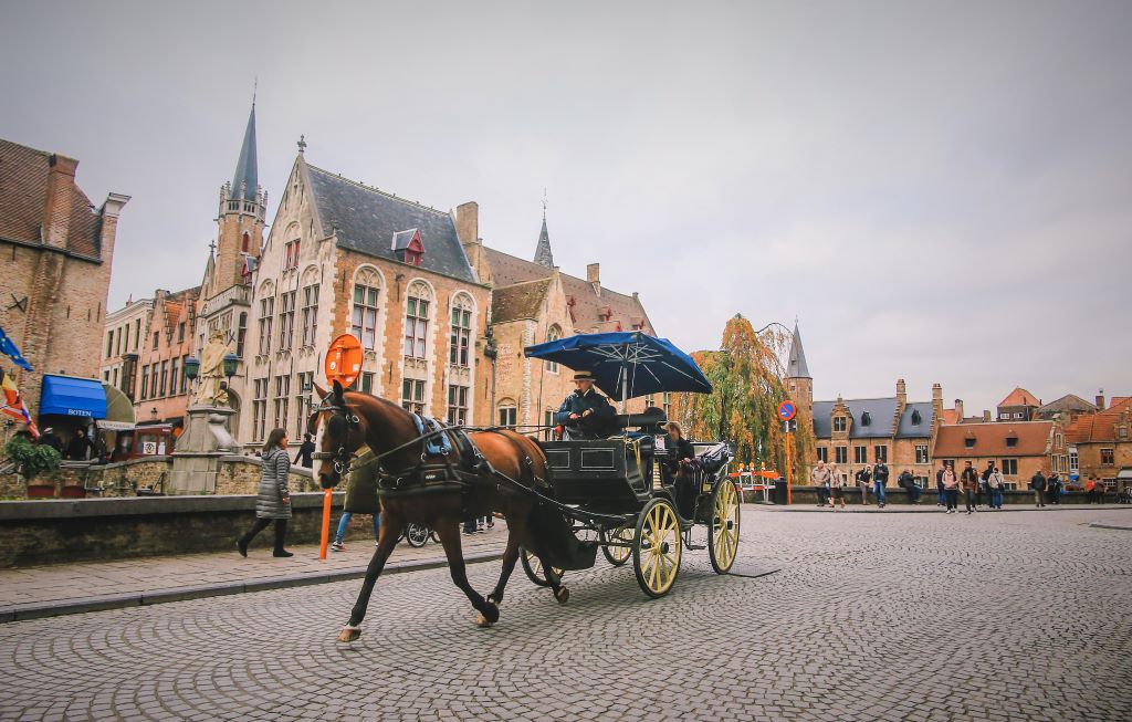 photo of a horse and carriage in bruges belgium