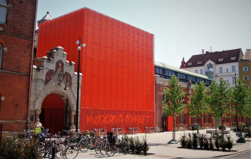 photo of a large red box shaped building in malmo sweden