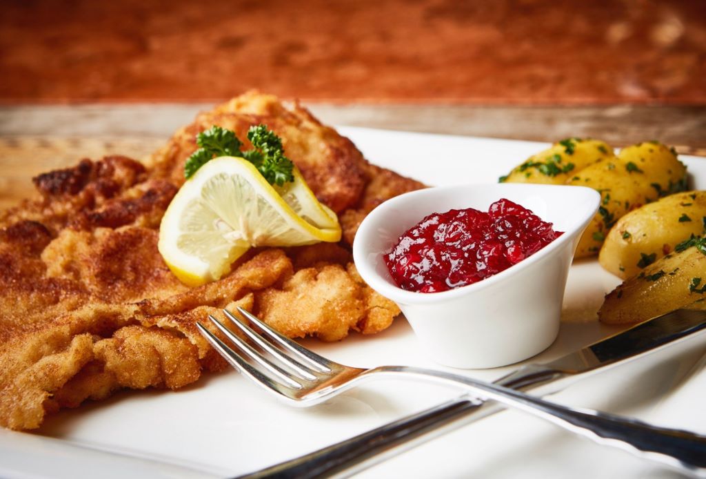 photo of a plate of schnitzel with fork
