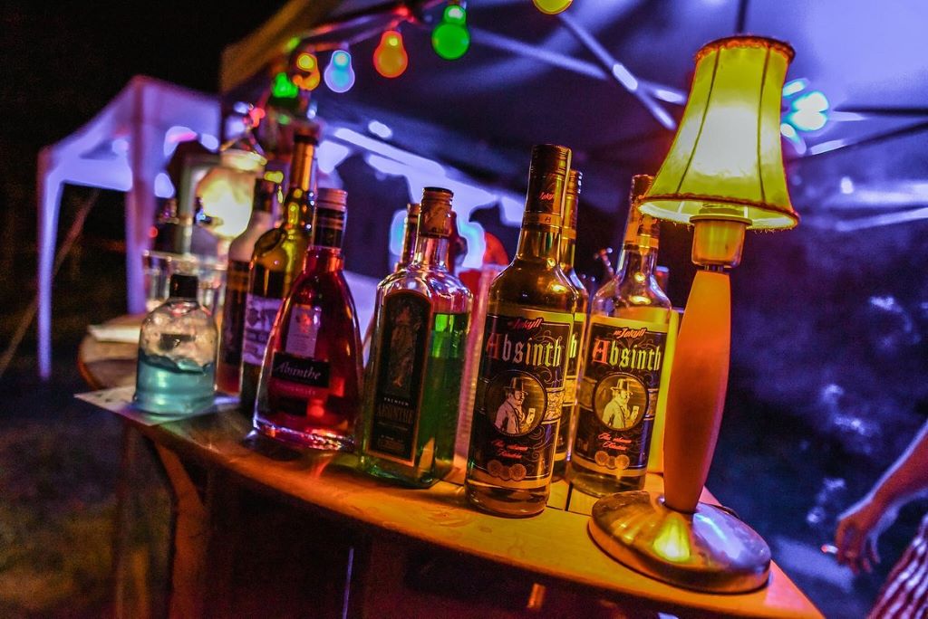 photo of bottles of alcohol next to lamp
