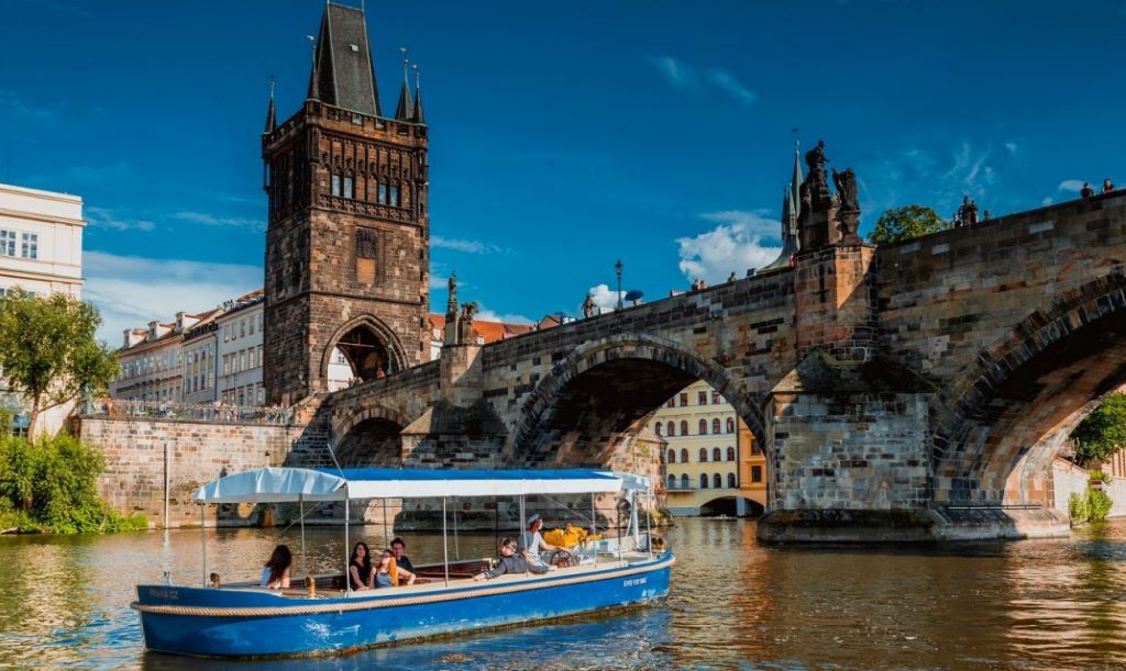 photo of a tour boat on a river in prague czech republic