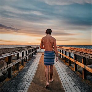 photo of man in a towel at sunset in malmo sweden