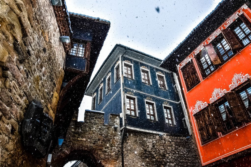 photo of colorful houses in plovdiv bulgaria during snowfall