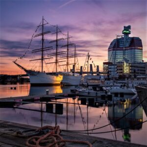 photo of a harbour with large ship at sunset in gothenburg sweden