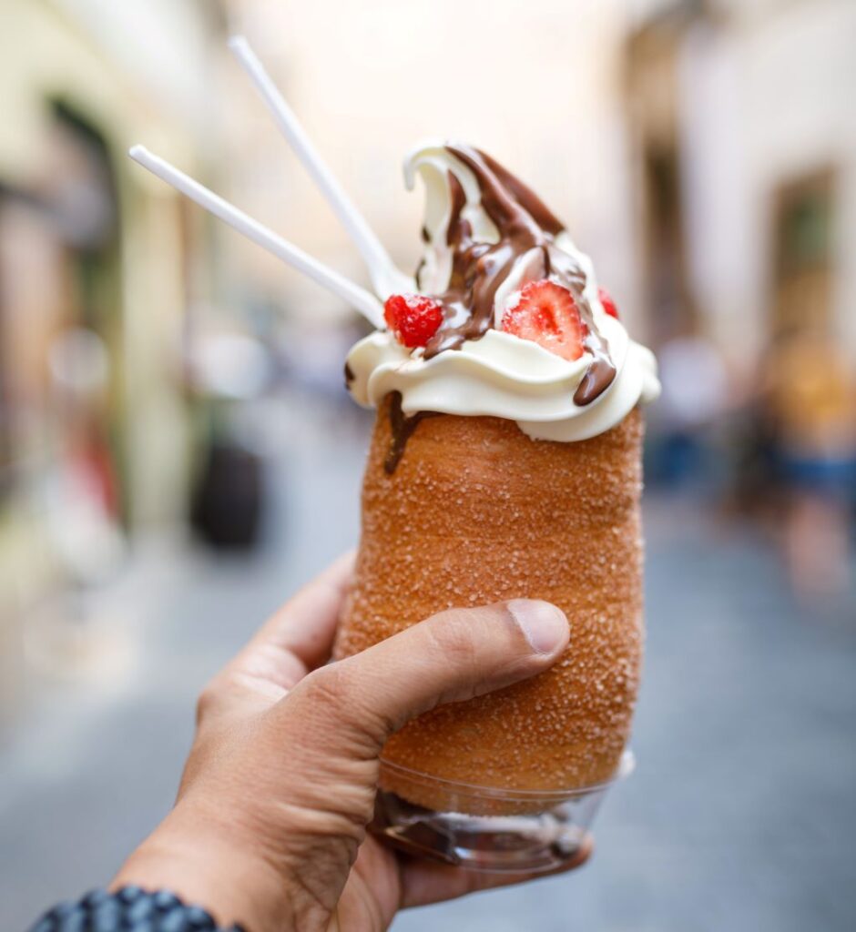 photo of a hand holding a cronut ice cream in prague czech republic
